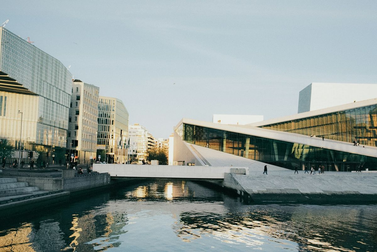 Oslo Opera House and modern city buildings by the waterfront