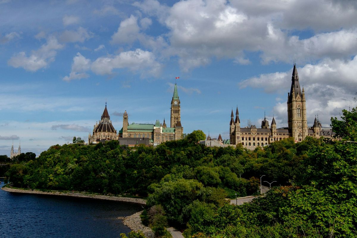 Parliament Hill building in Ottawa, Canada under blue sky