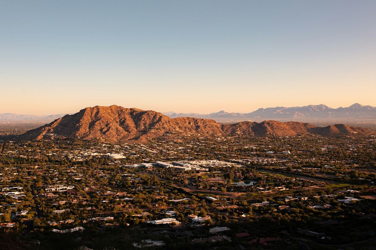 Aerial view of Phoenix Arizona skyline with desert mountains