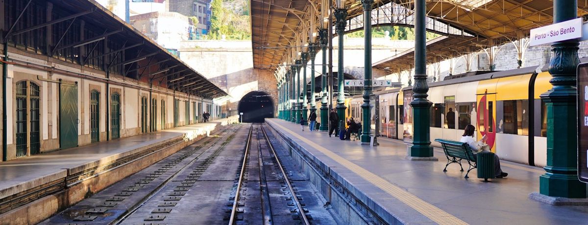 Train traveling along Porto metro station platform Portugal