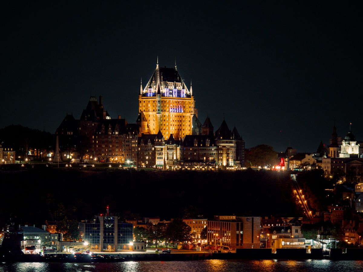 Evening cityscape with Chateau Frontenac castle silhouette in Quebec City