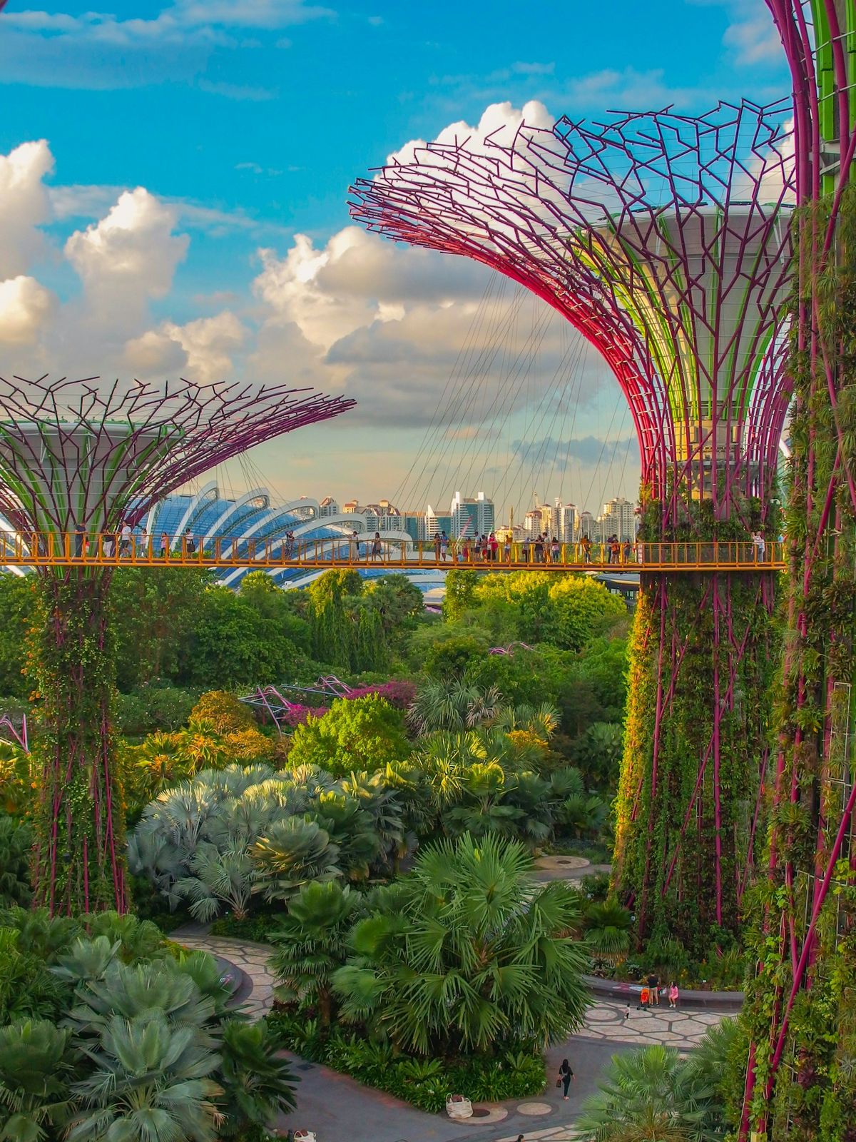 People crossing a bridge in Gardens by the Bay, Singapore