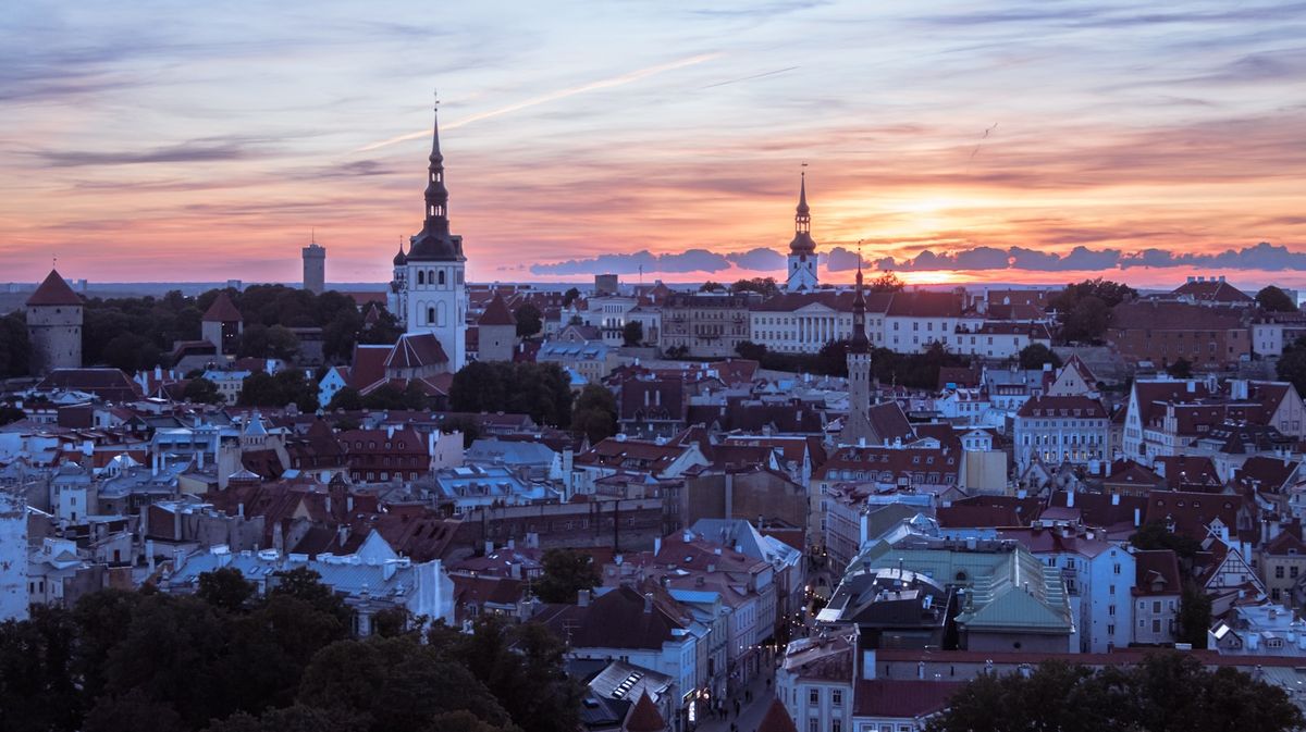 Tallinn old town towers seen from a hill at sunset