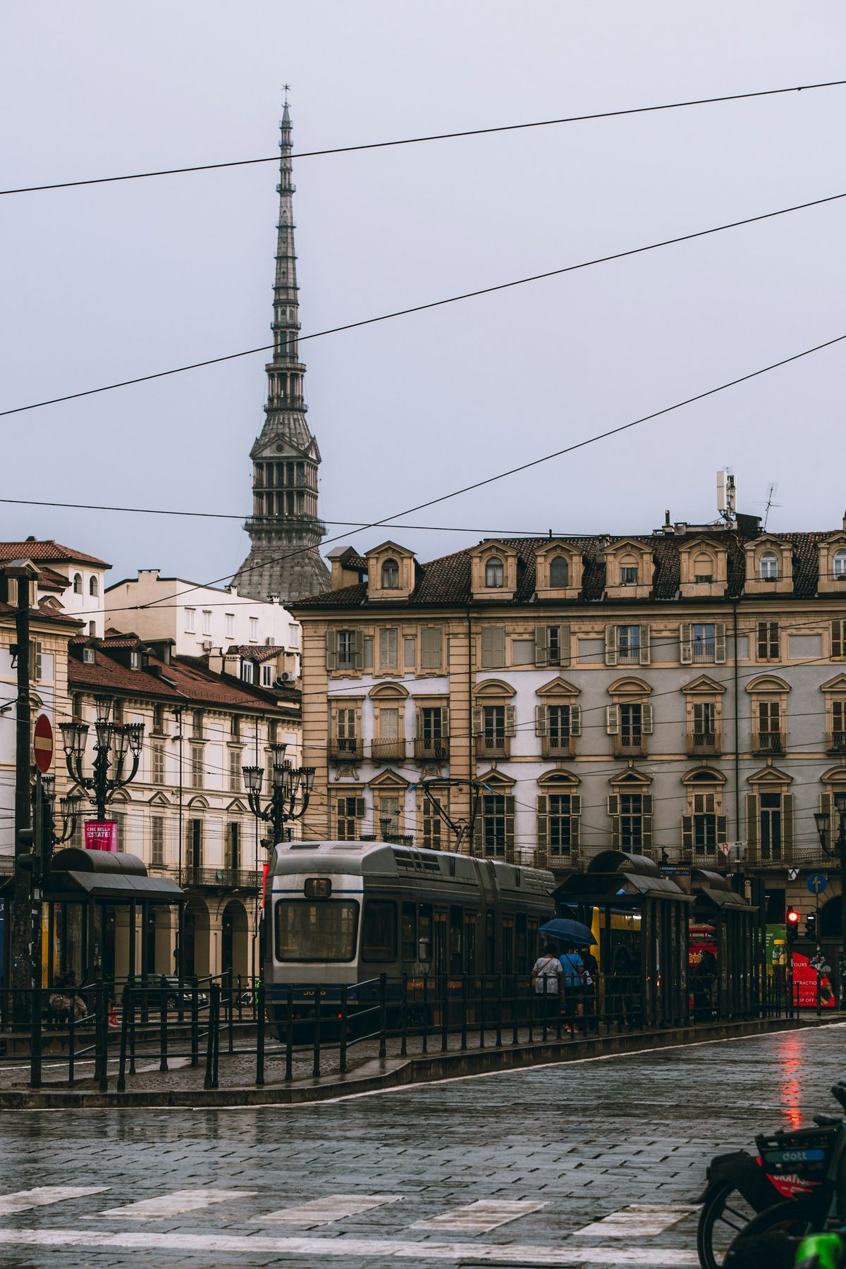 Tram on a rainy day with the Mole Antonelliana in the background, Turin