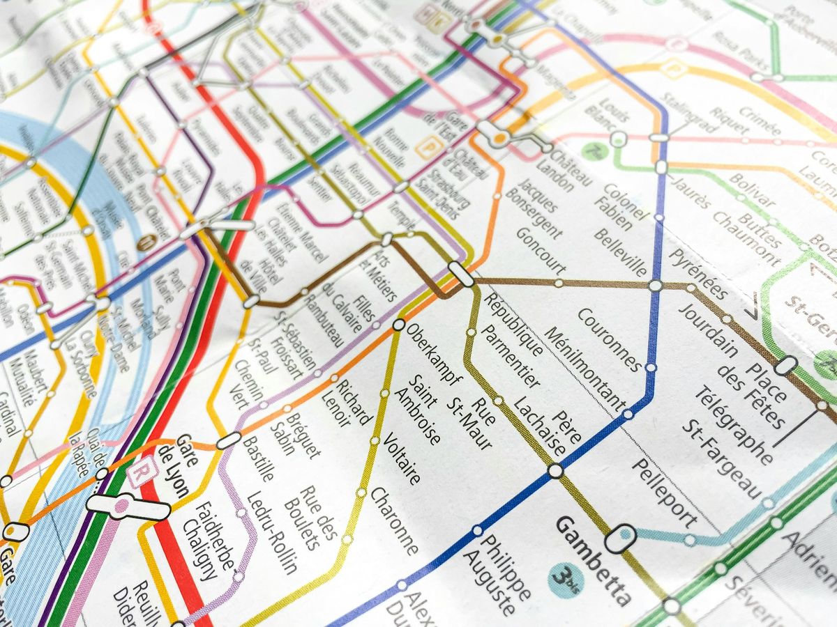 A close-up of a subway transit network map with multiple lines
