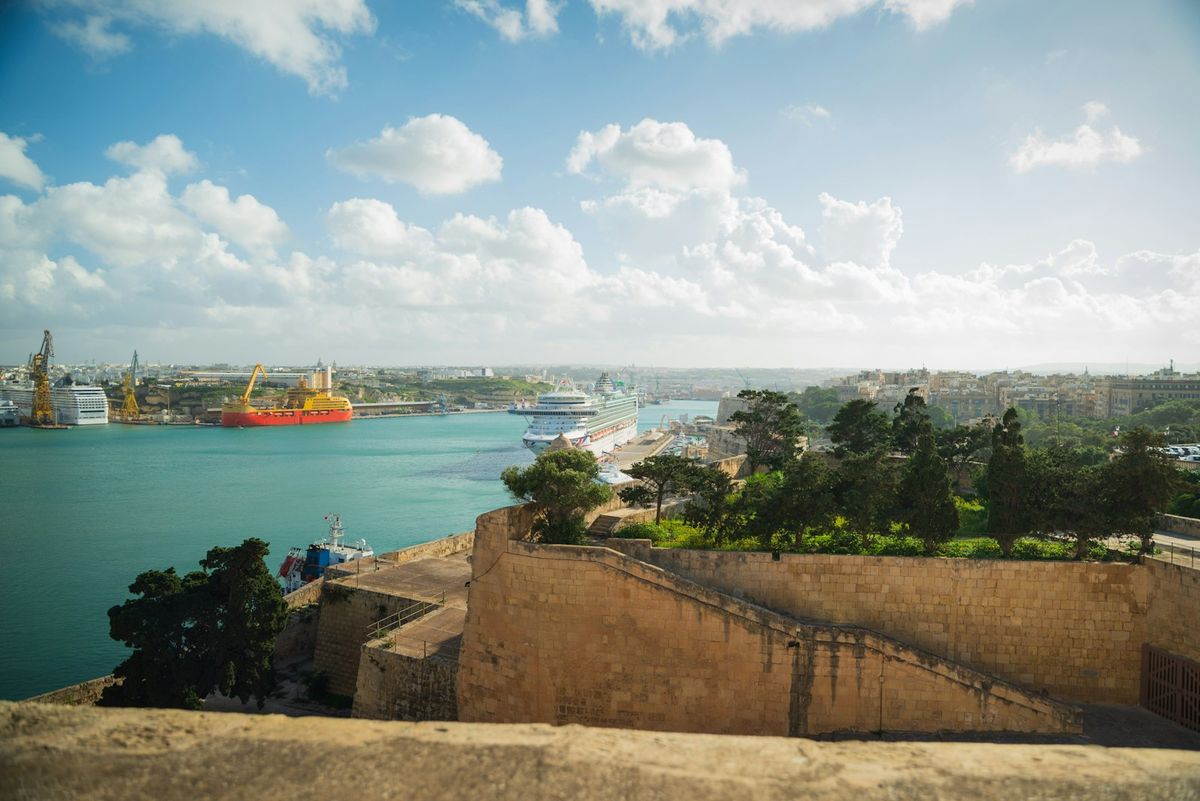 Cruise ship in Grand Harbour Malta with Valletta fortress walls