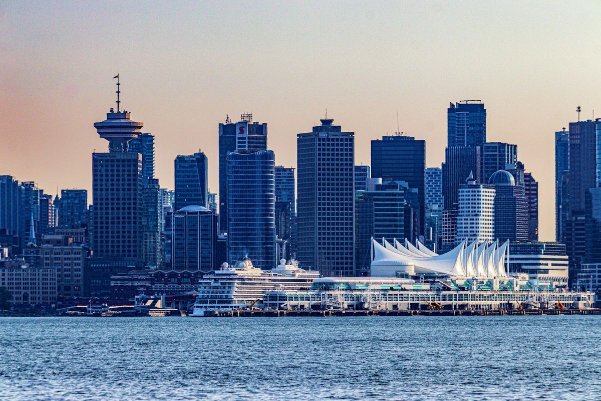 Vancouver skyline with Canada Place cruise terminal and cruise ship at the waterfront