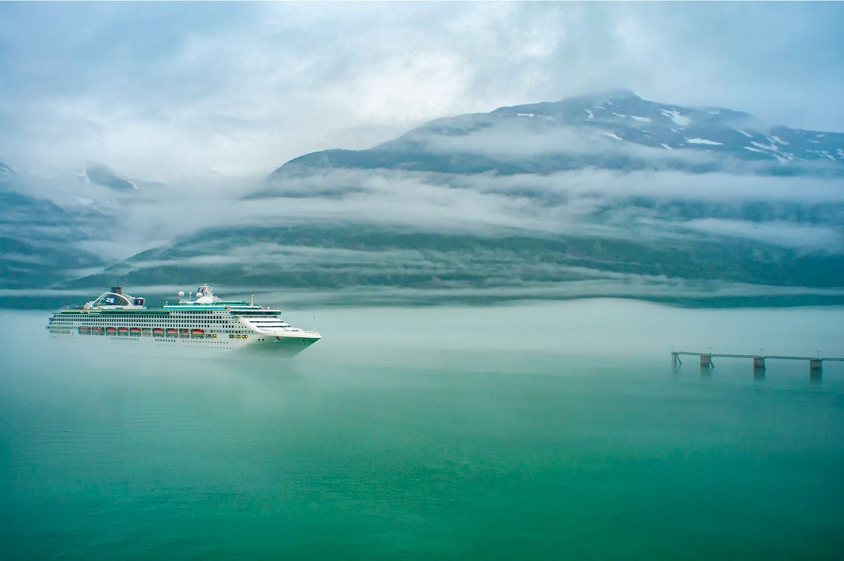 White cruise ship sailing through Alaska's Inside Passage