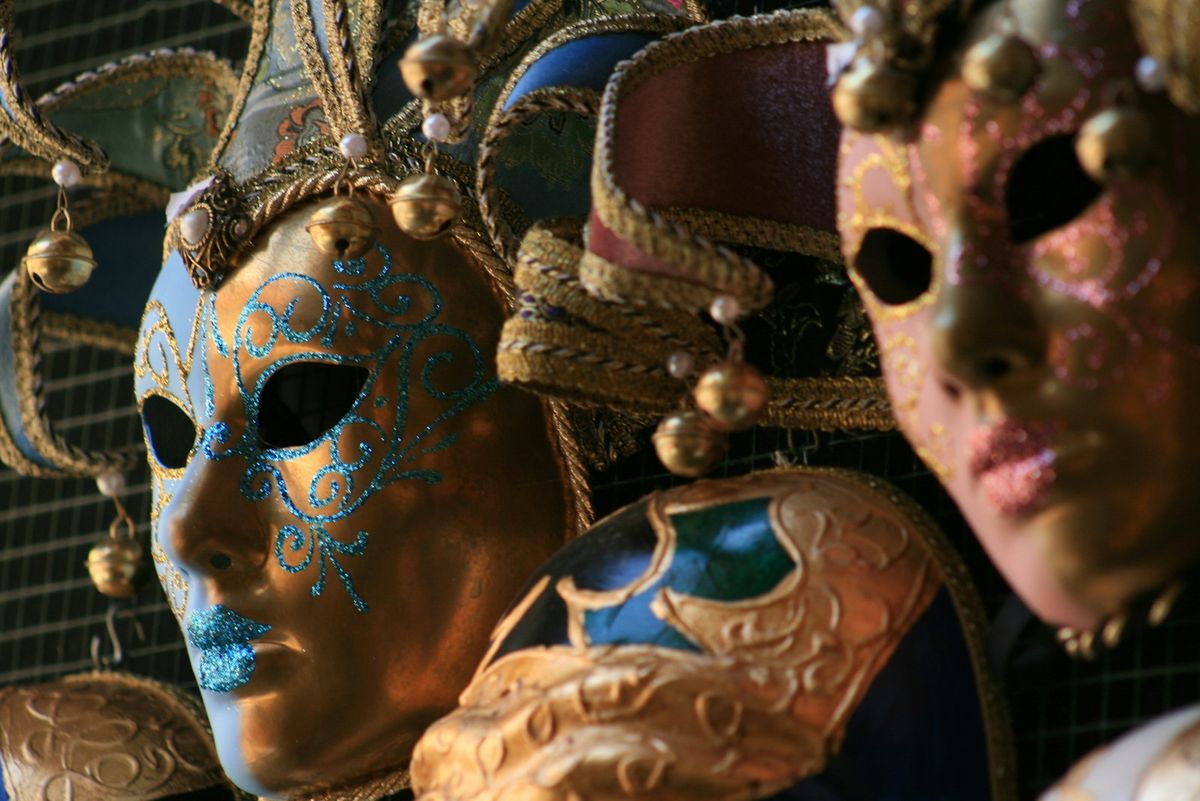 Close-up display of ornate Venetian carnival masks