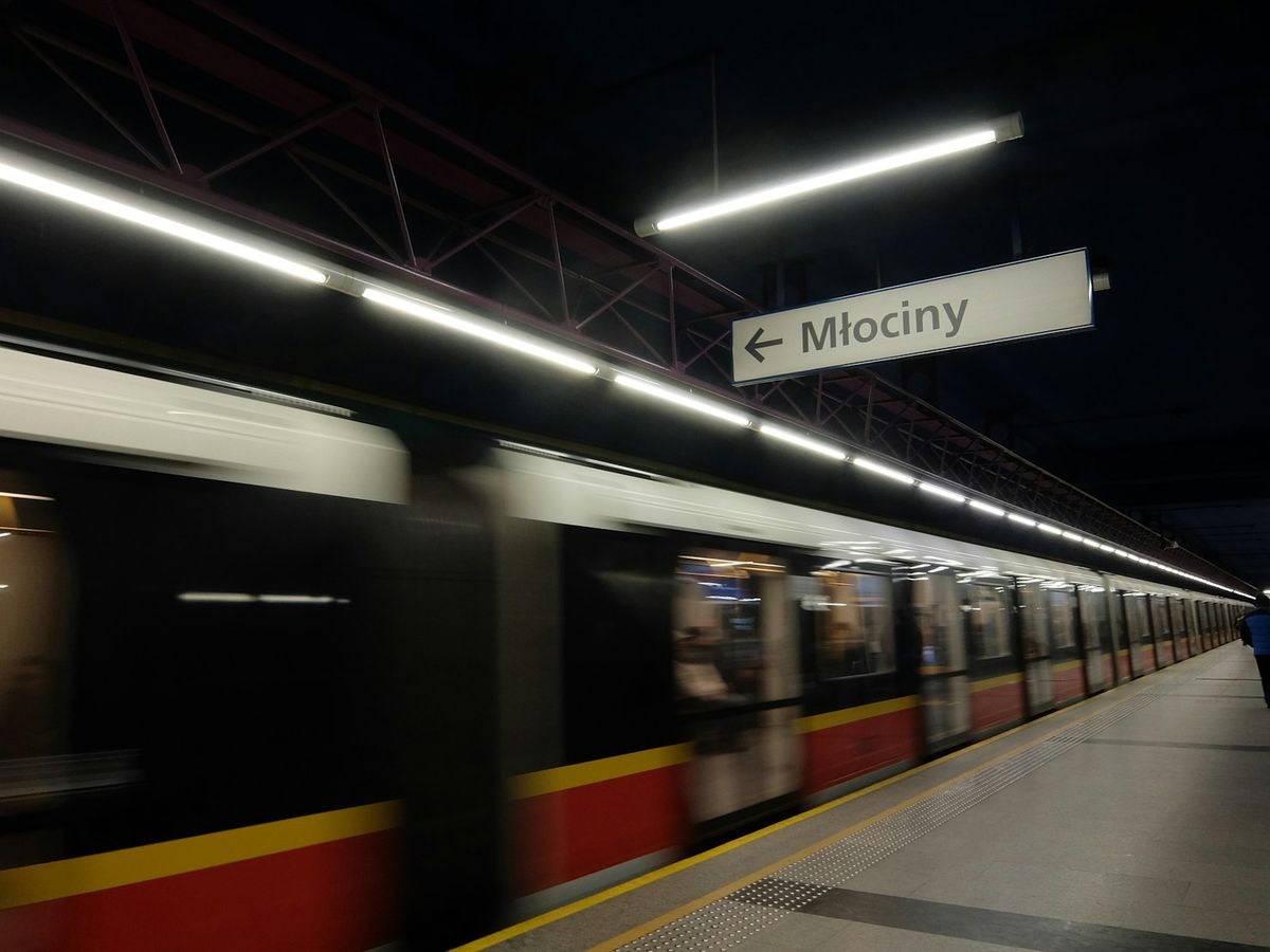 A train arriving at a Polish railway station platform