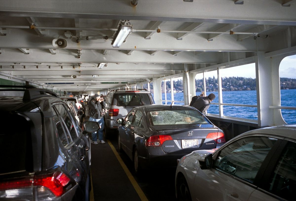 Cars parked on the vehicle deck of a ferry