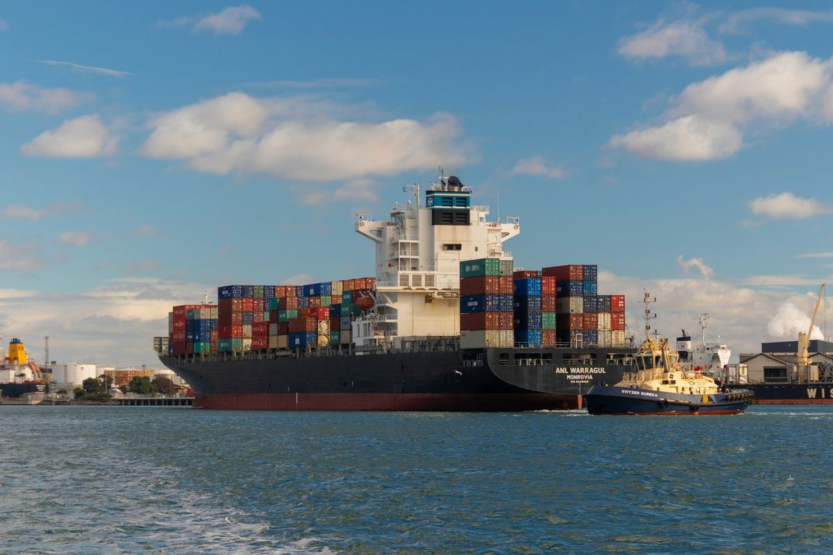 Cargo ship on the sea under a blue sky