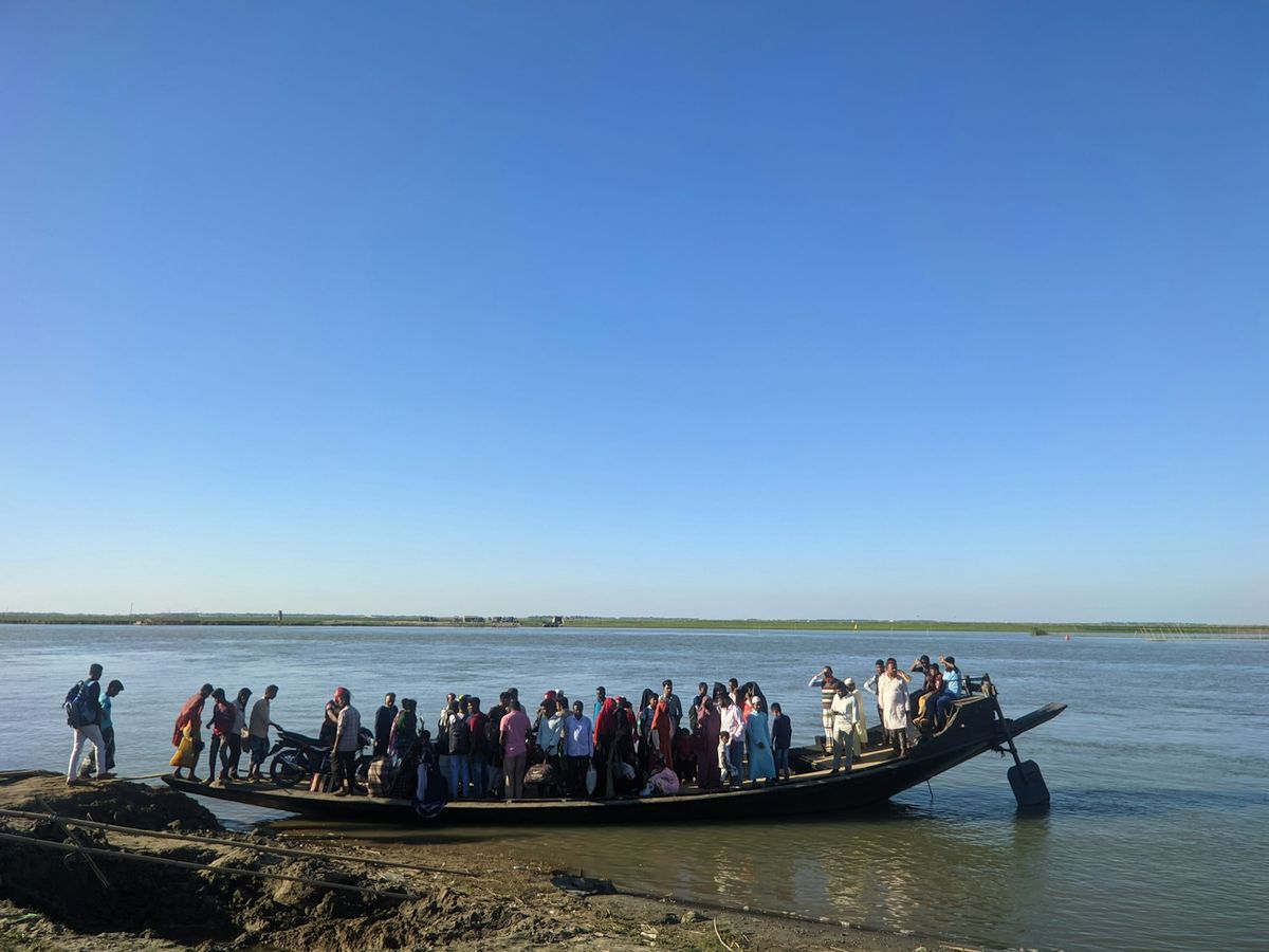 A large group of passengers on the deck of a river boat in Bangladesh