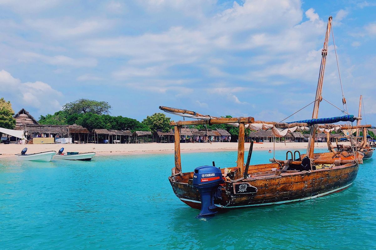 Traditional dhow sailing on the turquoise waters off Zanzibar, Tanzania