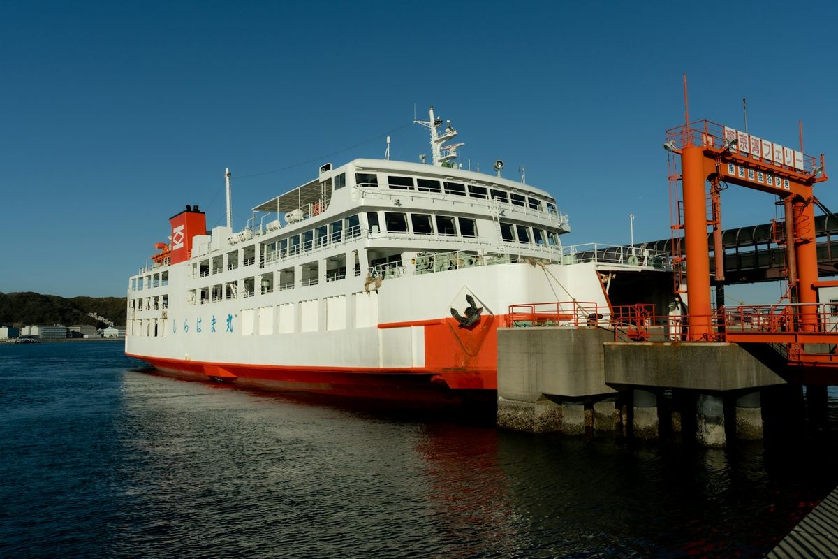 Large ferry docked at a port in Japan