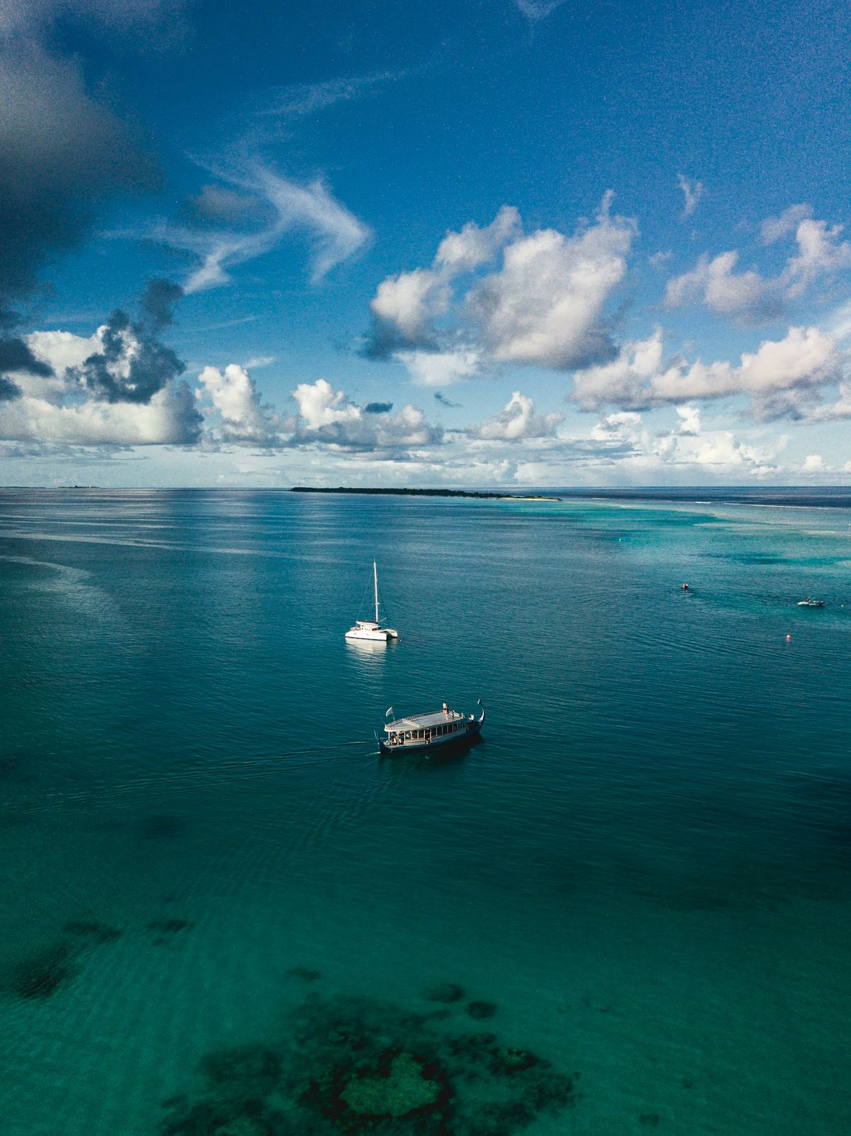Traditional Maldivian dhoni boat on turquoise water