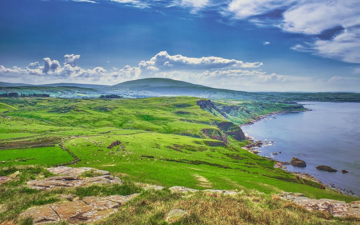 Green hillside overlooking the sea on the Isle of Man