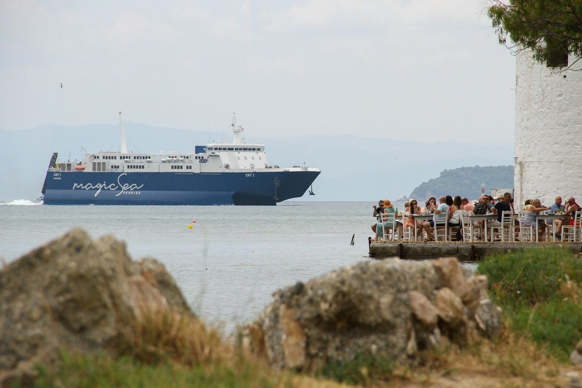 Large blue and white ferry boat on the sea