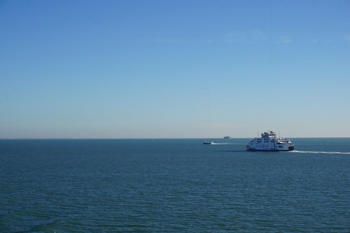 Ferries sailing on the clear blue Solent
