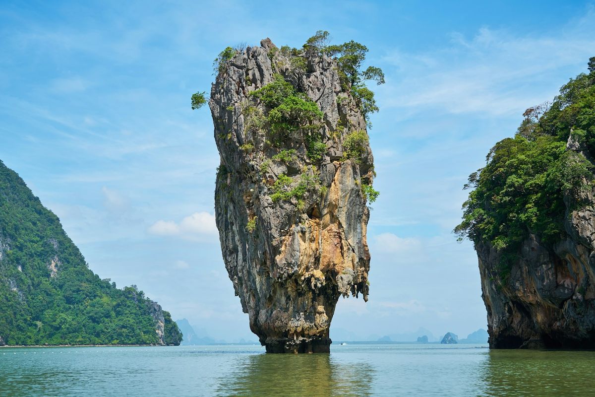 Iconic limestone rock formation rising from Phang Nga Bay