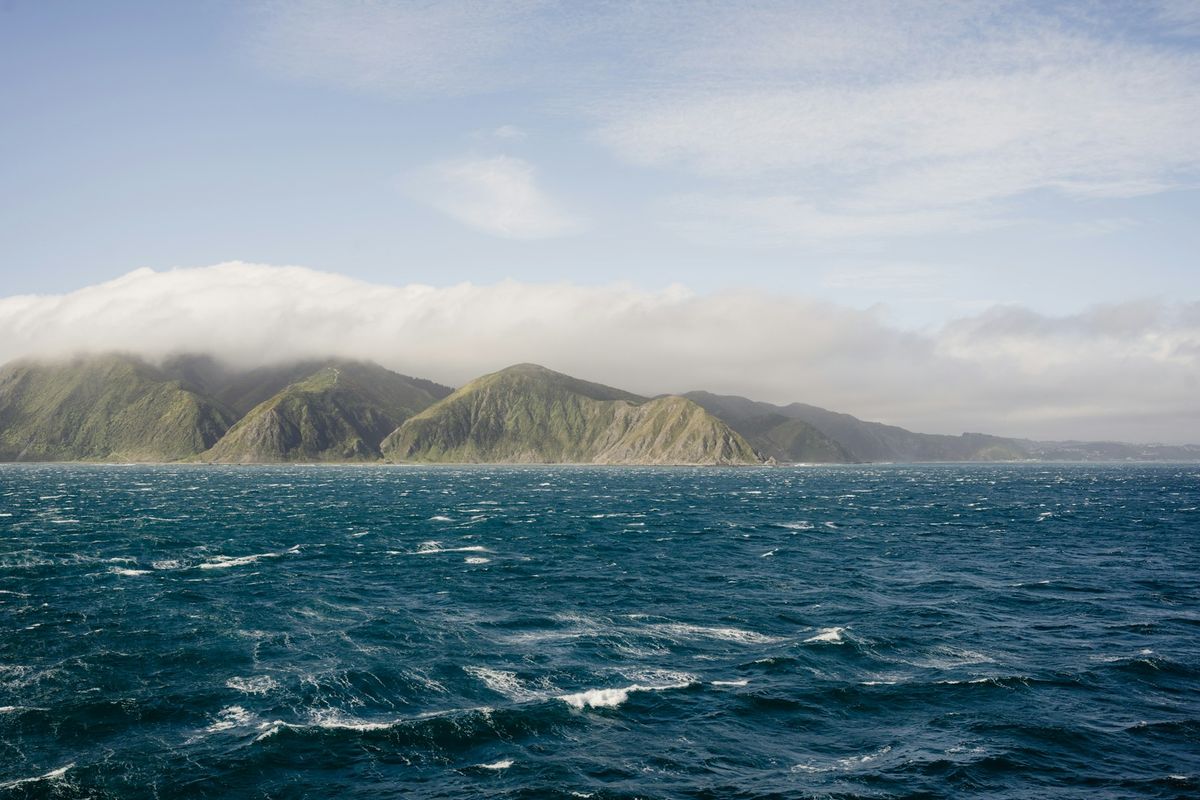Marlborough Sounds waterway surrounded by forested mountains, New Zealand