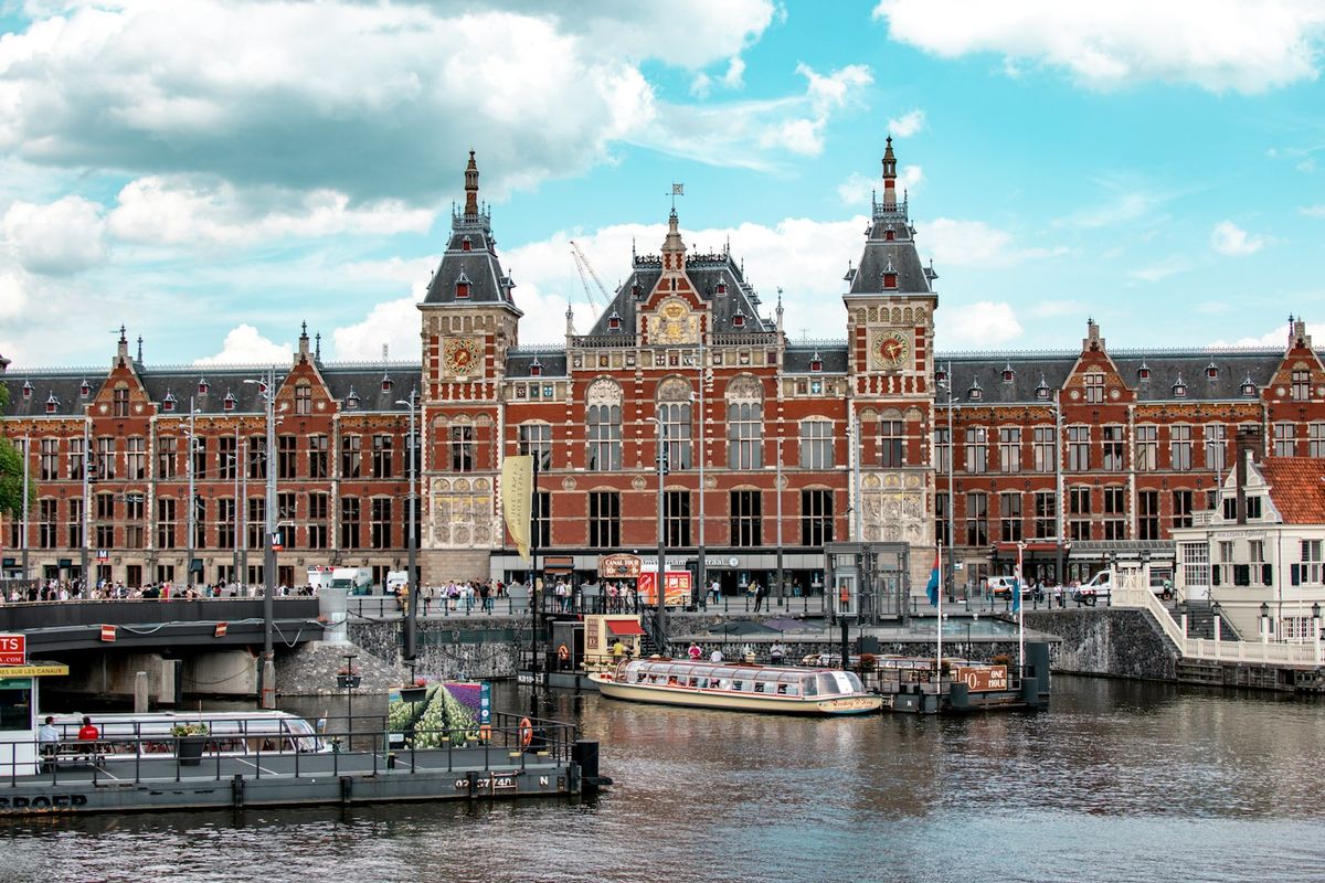 Amsterdam Centraal station facade with its ornate clock tower