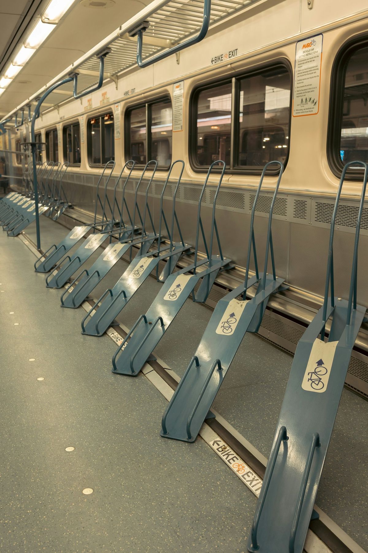 Empty bicycle storage racks inside a train carriage
