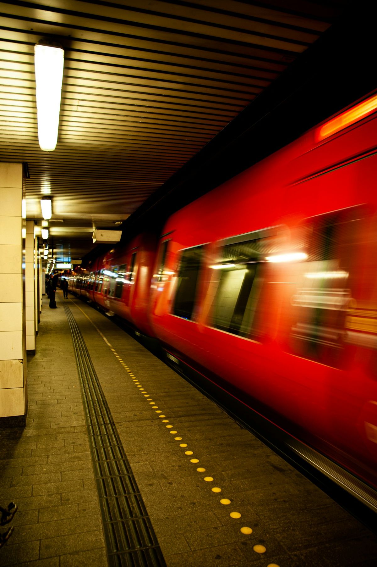 Red and white train at Danish railway station