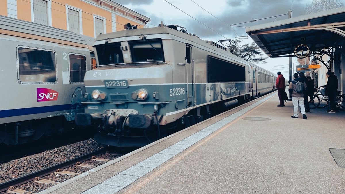 A French SNCF TGV high-speed train at a station