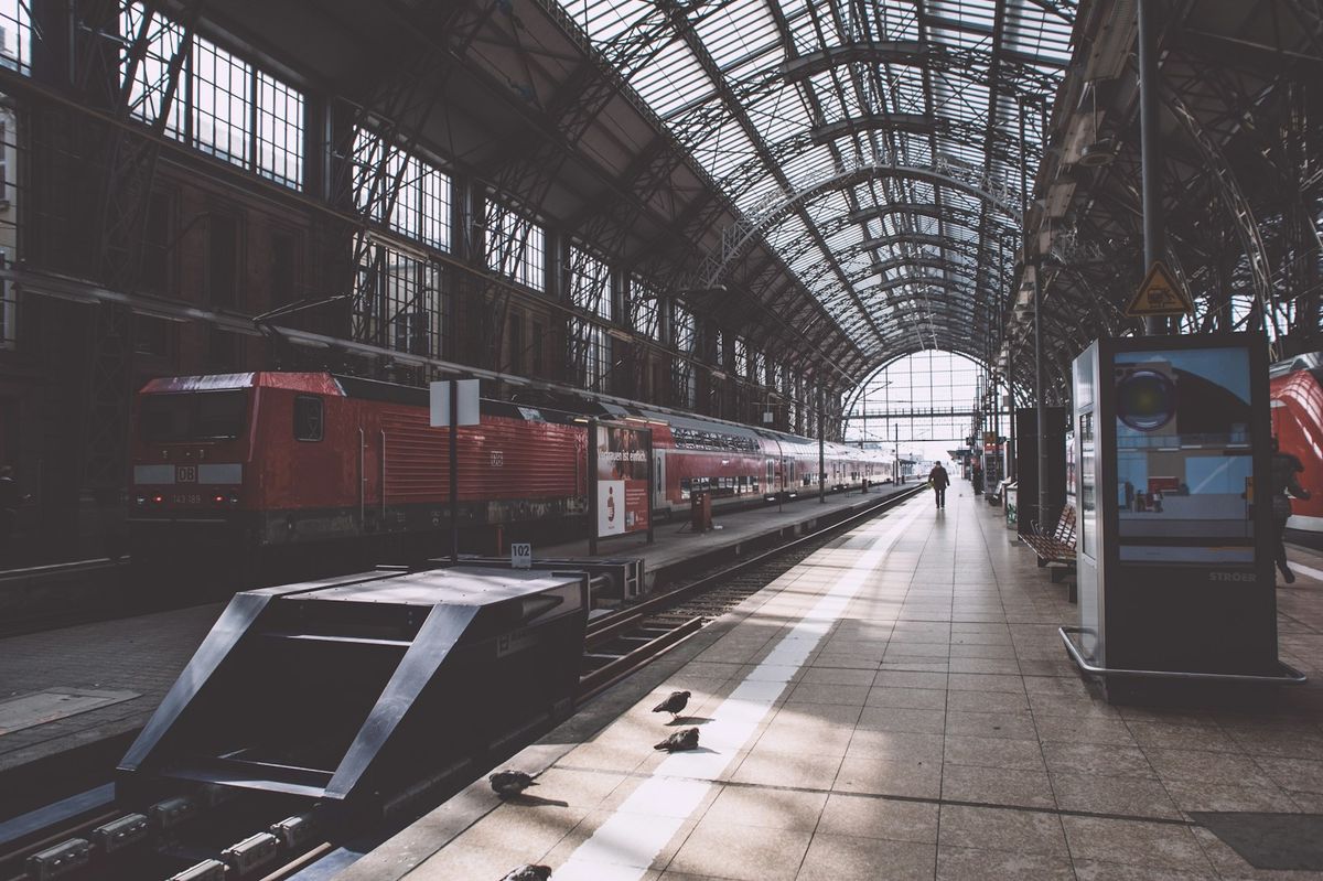 Red train inside a German train station