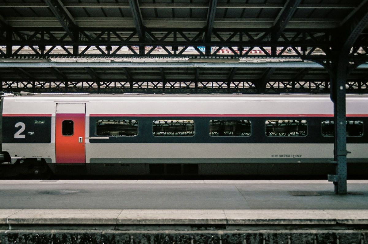 White and red high-speed train at a European station