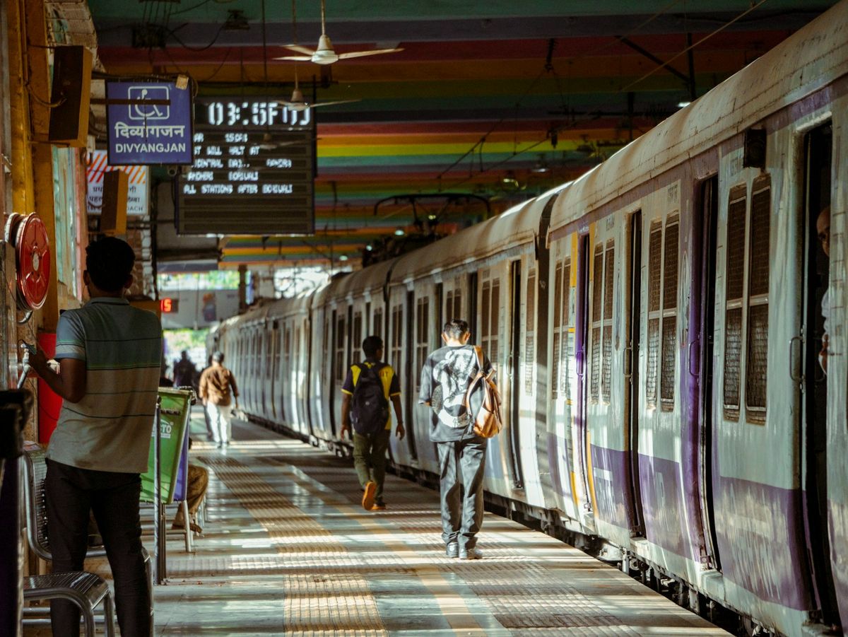 Commuters waiting on a crowded Indian railway station platform
