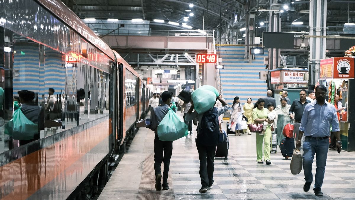 Busy train station platform with people in India