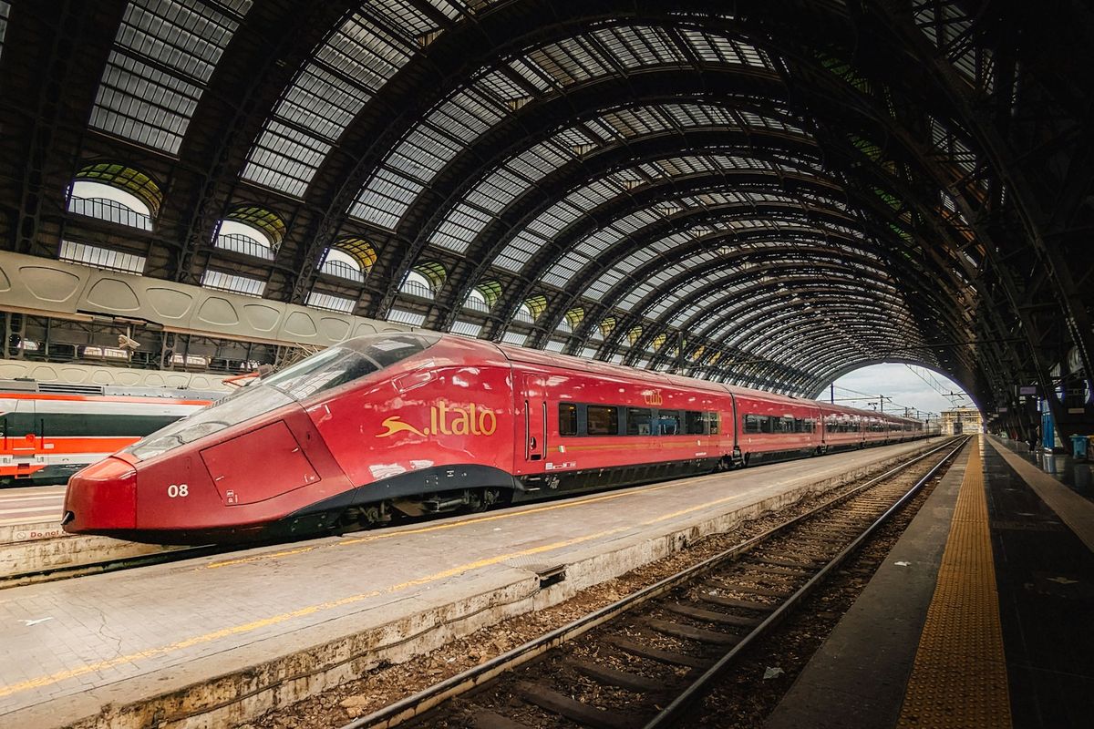 Frecciarossa high-speed train at a grand arched Italian station