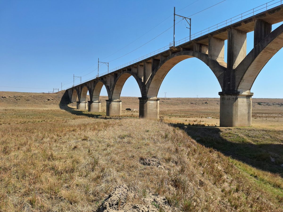 Elevated railway viaduct crossing the savannah in Kenya