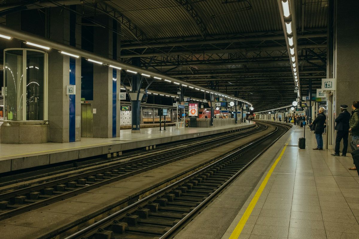 People waiting for a train at a station platform