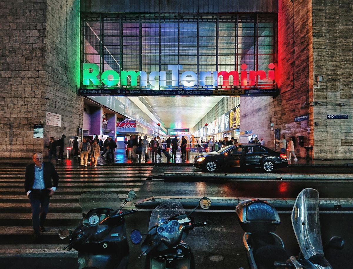 Roma Termini station sign illuminated at night