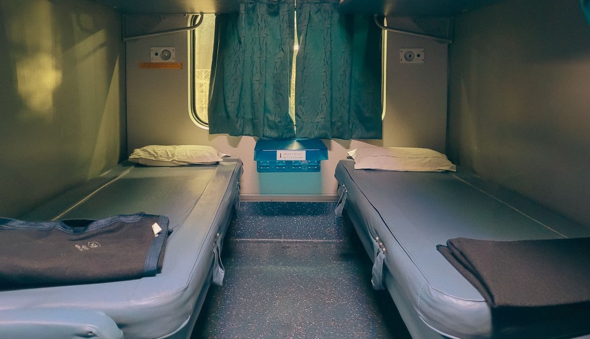 Two sleeping berths inside a train sleeper cabin