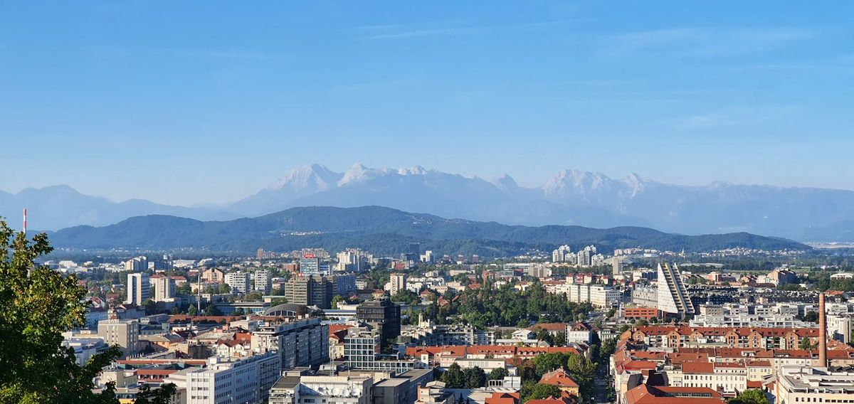 View of Ljubljana city with castle hill and mountains in Slovenia