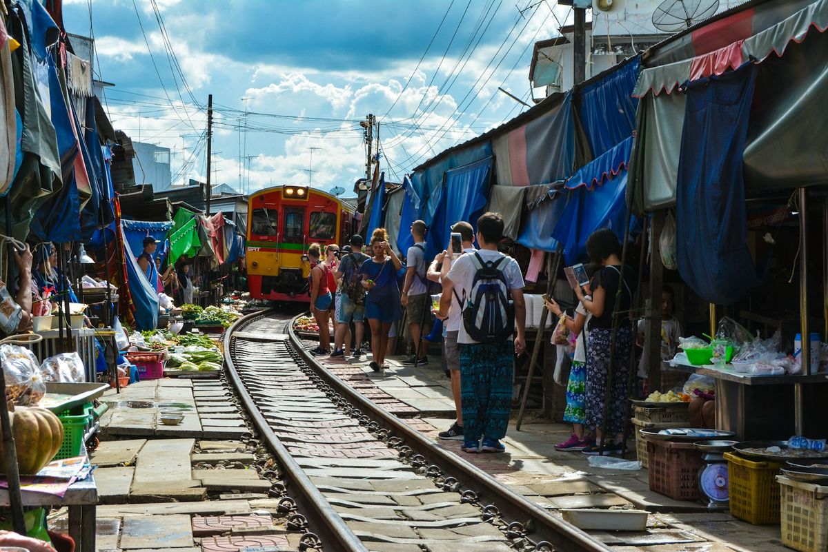 Red and orange passenger train in Thailand Southeast Asia