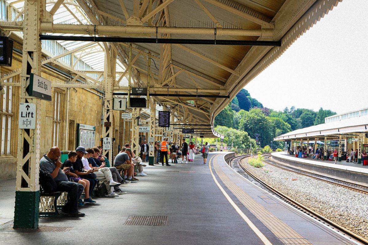 People waiting on a train station platform