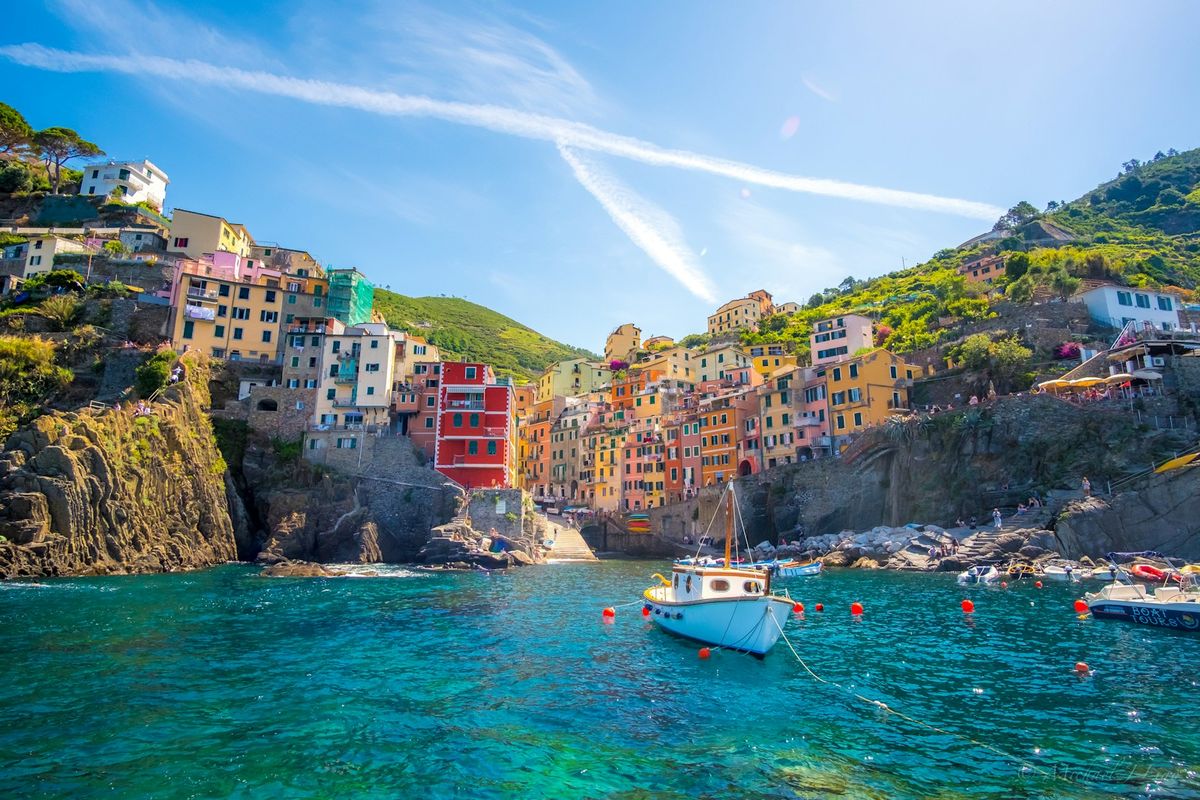 Blue fishing boat moored in Riomaggiore harbour Cinque Terre Italy