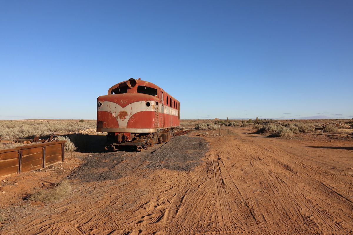 Train in the red outback desert landscape, Australia