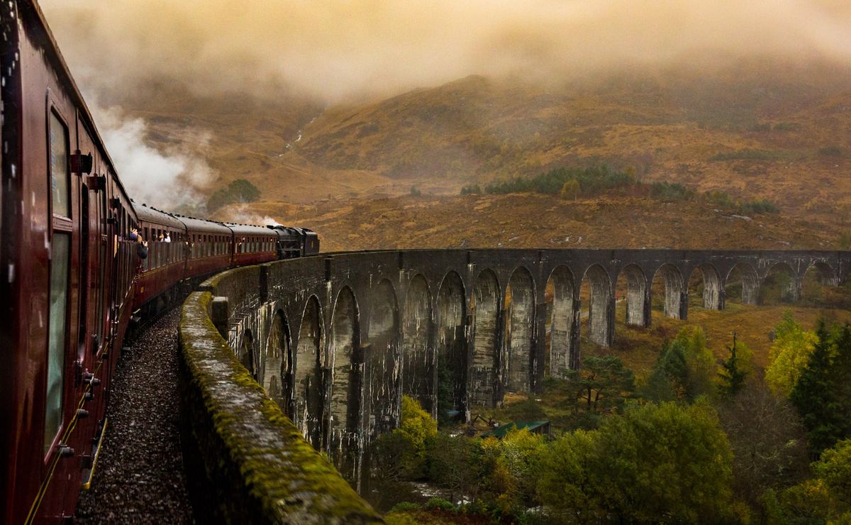 Steam train crossing the Glenfinnan Viaduct on the West Highland Line