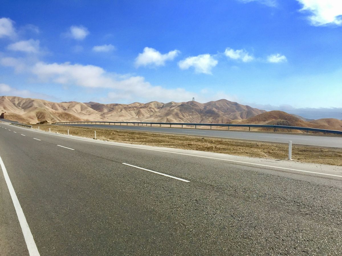 A long empty highway stretching toward the horizon