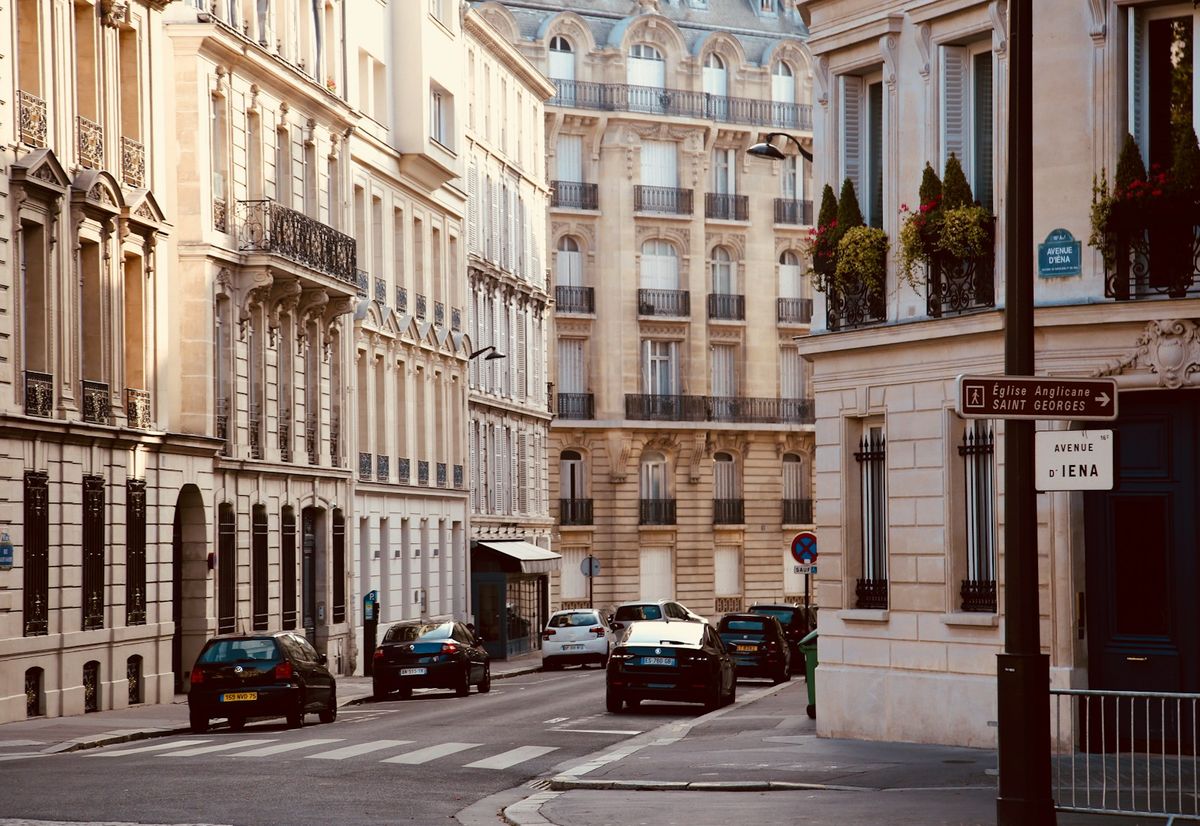 Cars parked along a European city street