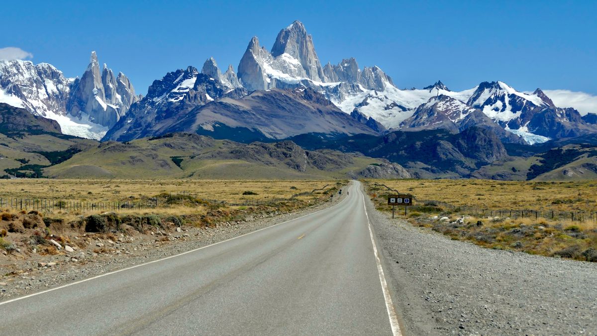 Lonely paved road stretching toward the Andes mountains in Patagonia, Argentina