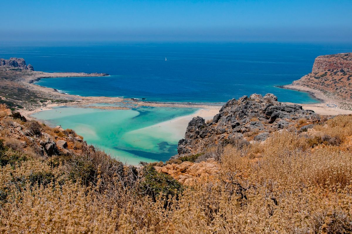 Green coastal landscape along a Greek mountain road