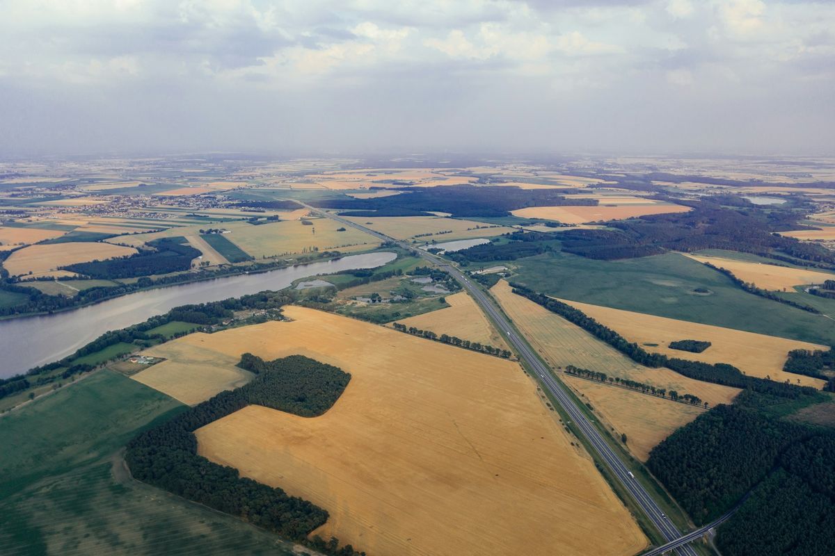 River road and agricultural fields in Poland