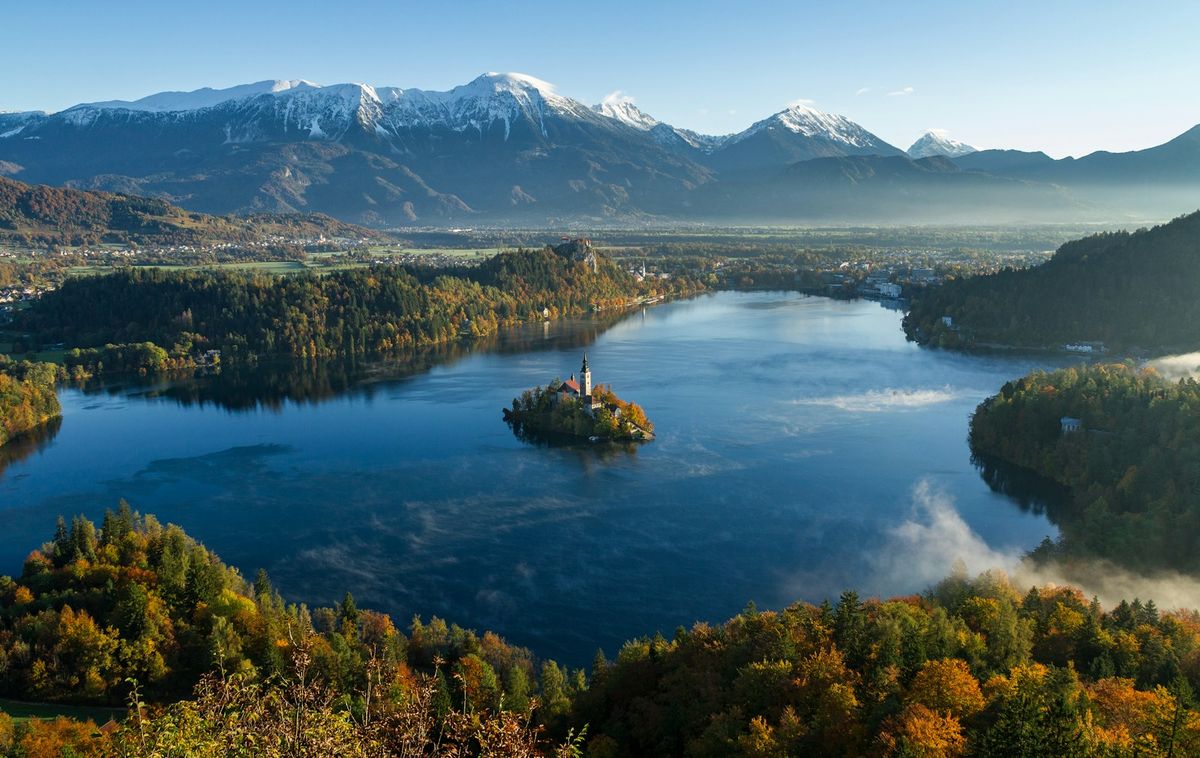 Lake Bled island and surrounding mountains Slovenia